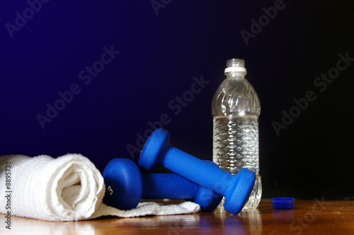 Workout equipment ( water bottle, weights and towell)