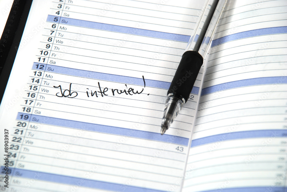 daily planner showing an appointment for a job interview daily planner showing an appointment for a job interview