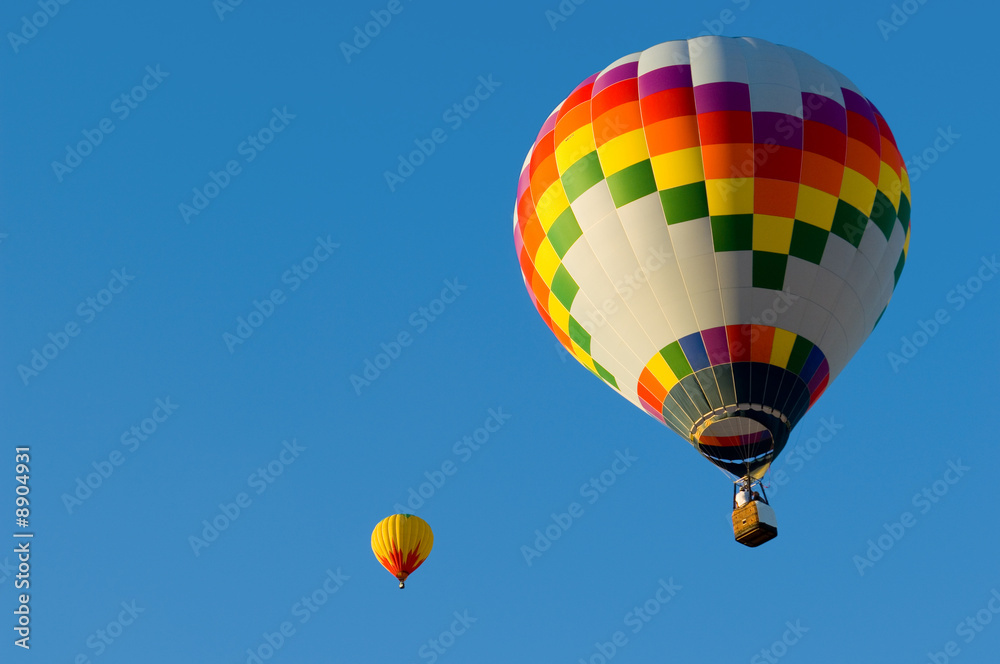A hot air balloon with a blue sky background A hot air balloon with a blue sky background