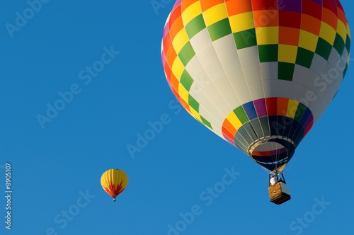 A hot air balloon in front of a blue sky with copy space