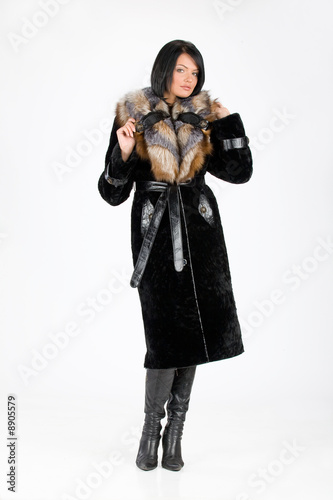 Young attractive woman in furcoat