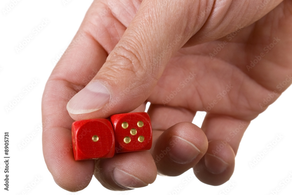 Hand holding two red dice ready to roll Hand holding two red dice ready to roll