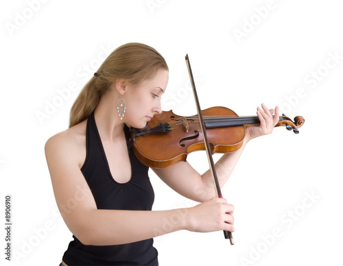 A young girl plays on a violin