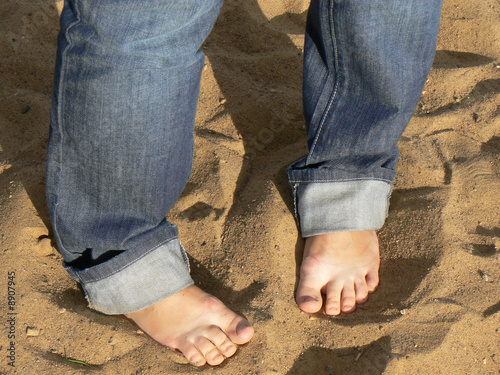 Legs on sand © daw666