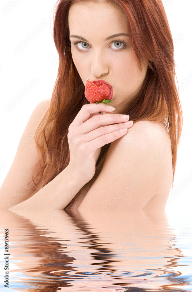 picture of lovely girl with strawberry in water picture of lovely girl with strawberry in water