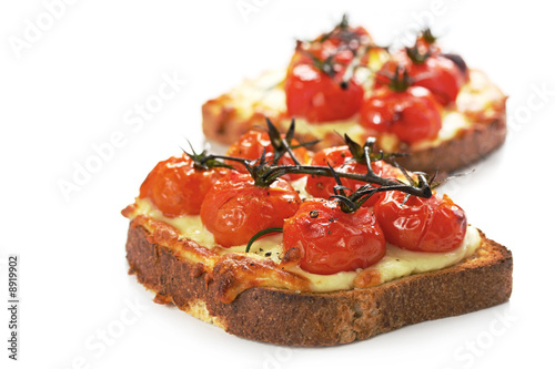 Bilde på lerret Cherry truss tomatoes over melting grilled cheese