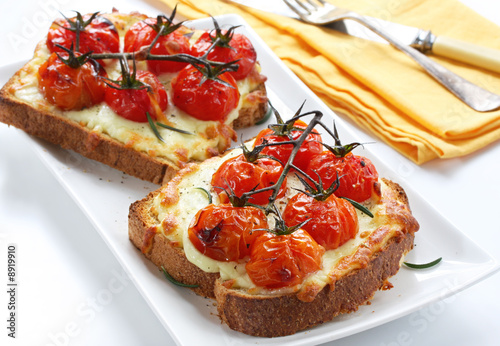 Bilde på lerret Open sandwiches with grilled cheese and roasted tomatoes.