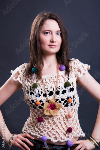 The young woman in summer clothes. Studio shoot