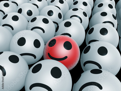 Foto unique red happy face inside unhappy ones