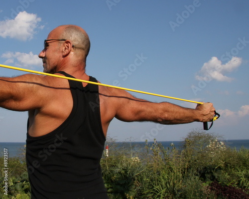 Kettlebell trainer working out with skipping rope