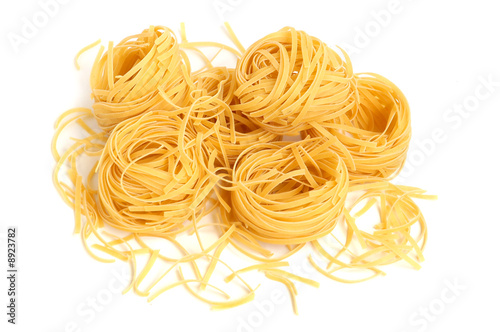 Italian pasta tagliatelle isolated on white