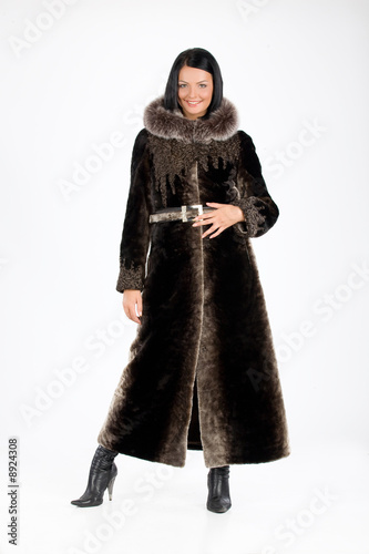Young attractive woman in furcoat