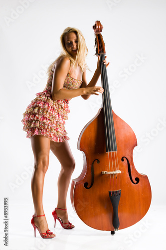 Young attractive woman and contrabass