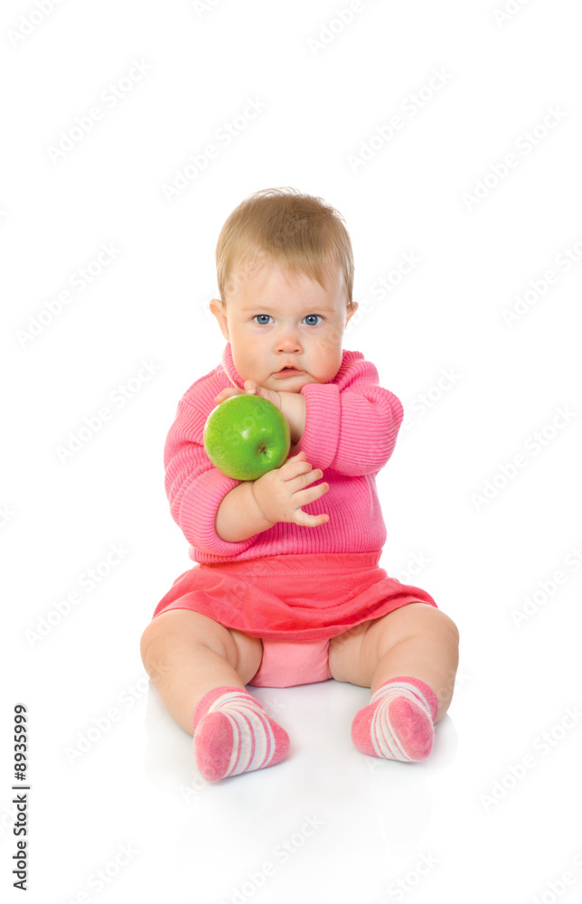 Small baby with green apple isolated on white Small baby with green apple isolated on white