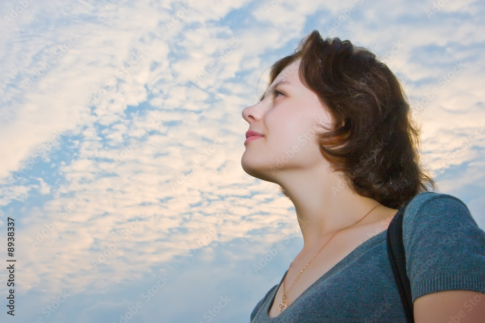 Portrait of the beautiful girl on a background of the blue sky Portrait of the beautiful girl on a background of the blue sky