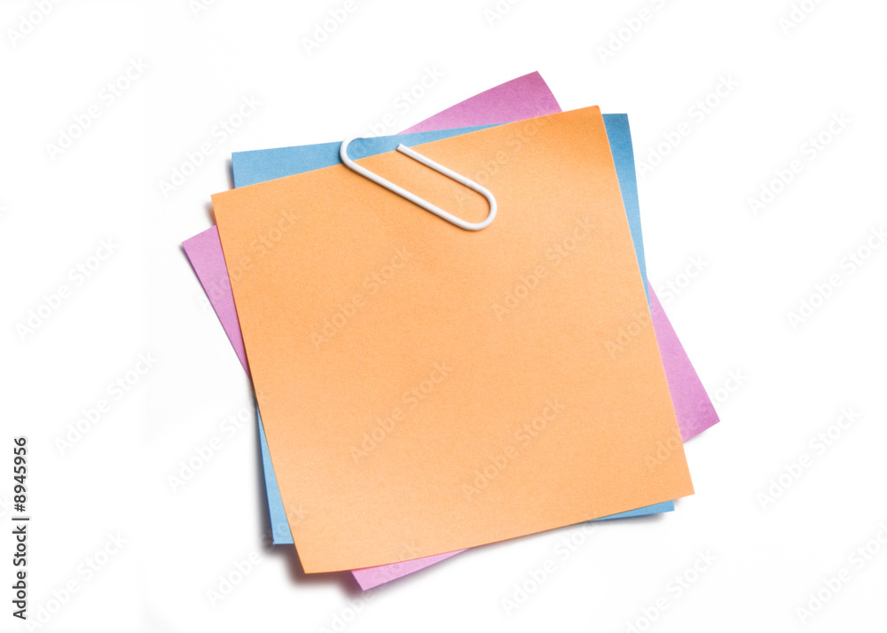 Stacked clipped sticky notes on white Stacked clipped sticky notes on white