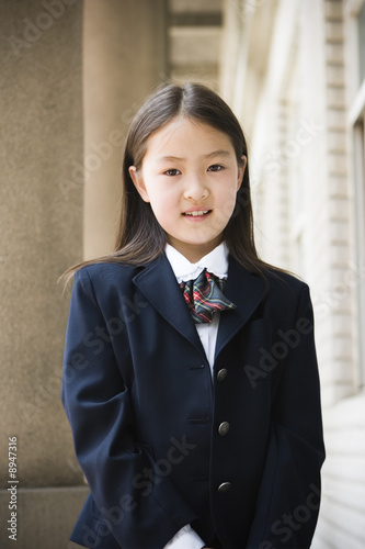 elementary schoolgirl in school uniform