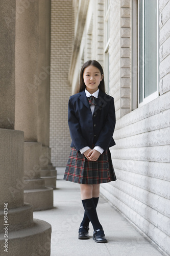 elementary schoolgirl in school uniform
