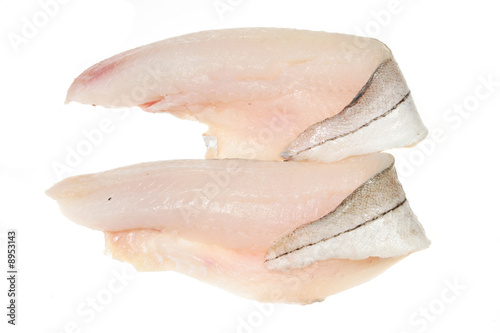 Two haddock fillets on a white background