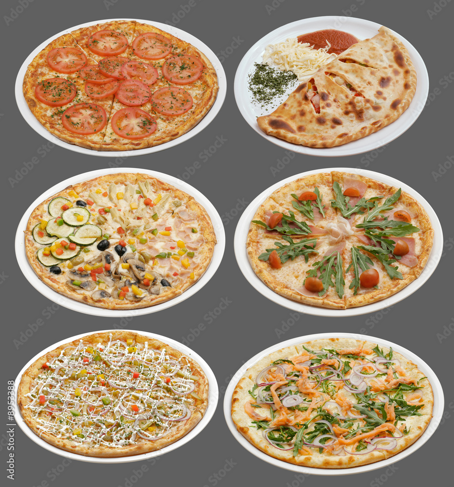 Six pizzas on white plates. Grey background. Six pizzas on white plates. Grey background.