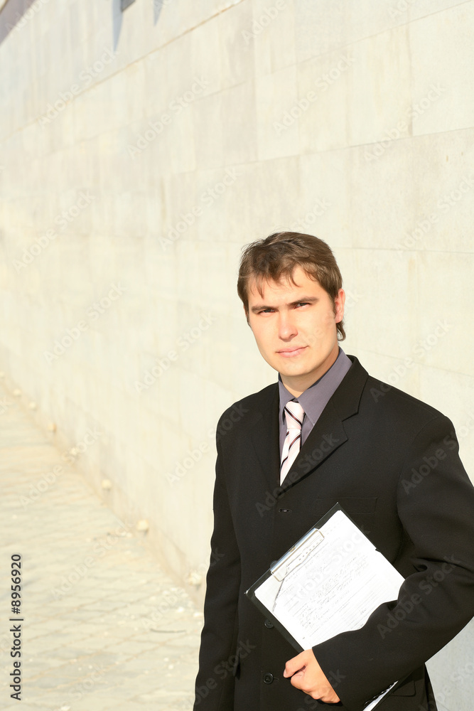 Business background: handsome businessman in a work process. Business background: handsome businessman in a work process.