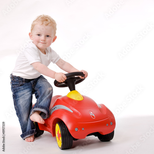 Cute caucasian blond toddler ishappy and playfull