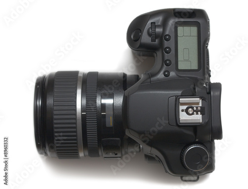 The film camera with an objective on a white background