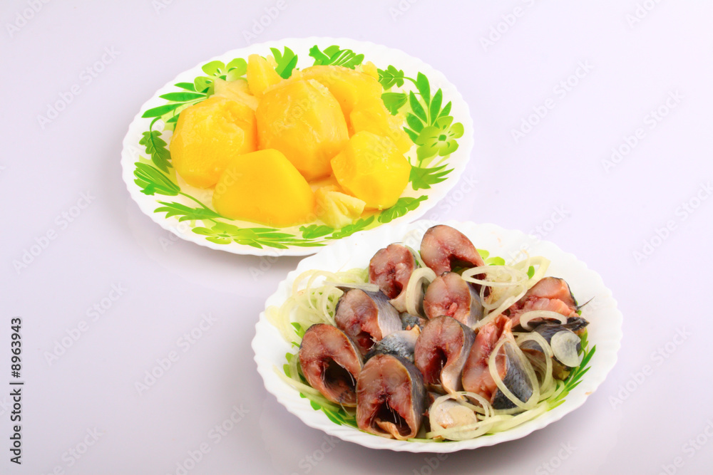 Boiled potato and herring with an onions in oil Boiled potato and herring with an onions in oil