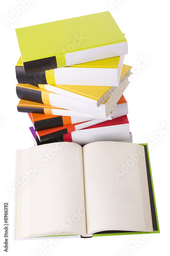 Open book and pile of books isolated on white..