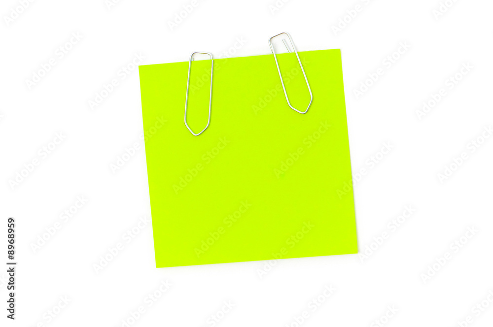 Green reminder note with paperclips isolated on the white Green reminder note with paperclips isolated on the white
