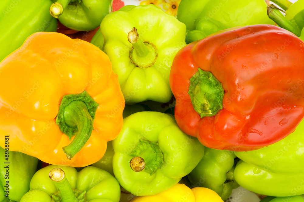 Colourful bell peppers arranged at the market stand Colourful bell peppers arranged at the market stand