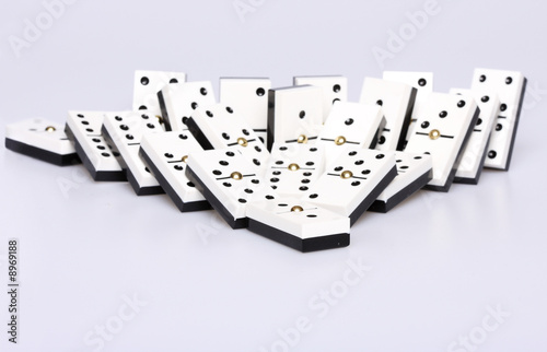dominos falling over, concept of cause and effect photo