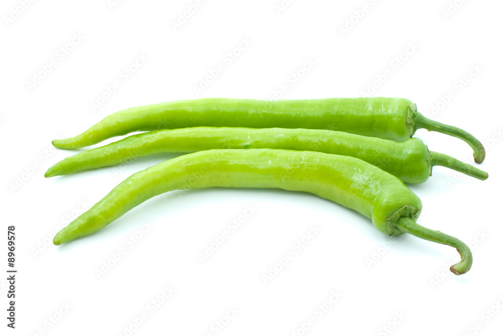 Three green chili peppers isolated on the white background Three green chili peppers isolated on the white background
