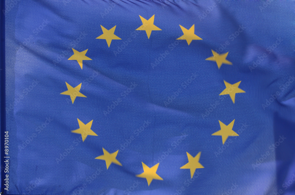 The flag of the european union, parts of it blurry due to wind The flag of the european union, parts of it blurry due to wind