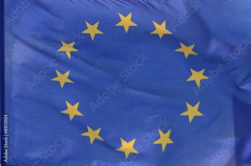 The flag of the european union, parts of it blurry due to wind
