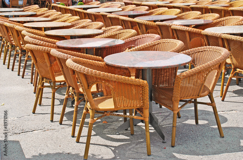 restaurant street terrace with wicker chairs
