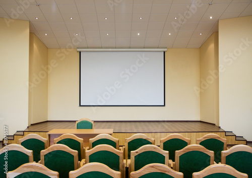 Modern auditorium hall for presentation with projection screen