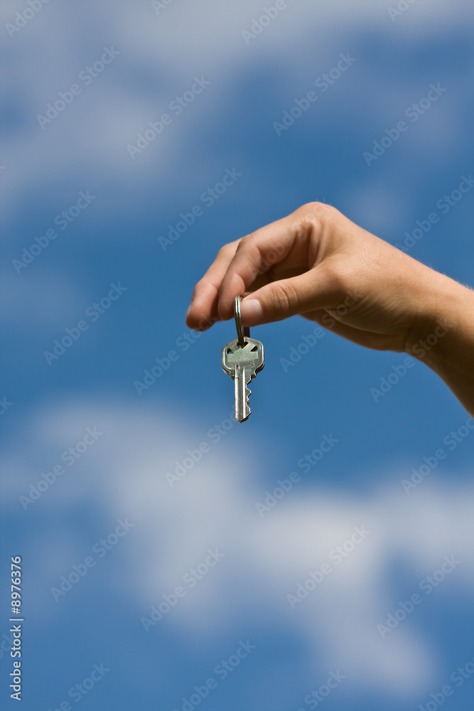 woman handing another woman keys to a house woman handing another woman keys to a house