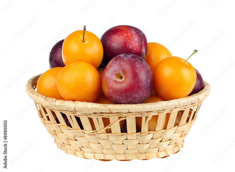 Plum fruit violet and yellow in basket Plum fruit violet and yellow in basket