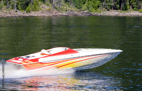 A speedboat on a lake