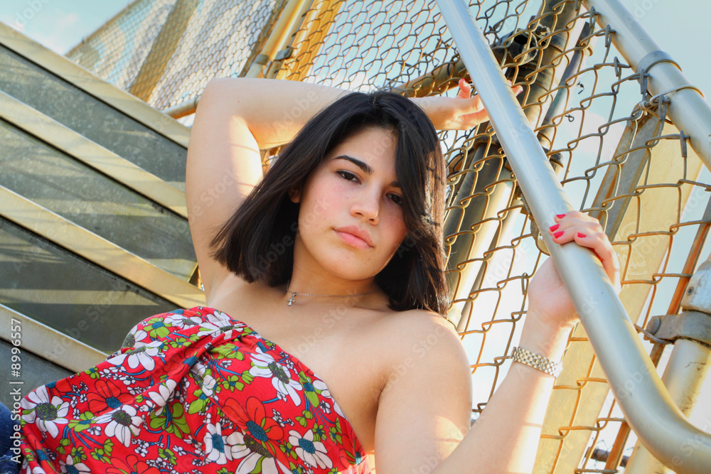 Fototapeta premium Woman posing on a staricase