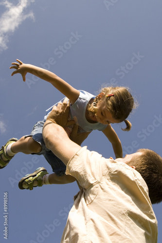 Father and daughter on the sky photo