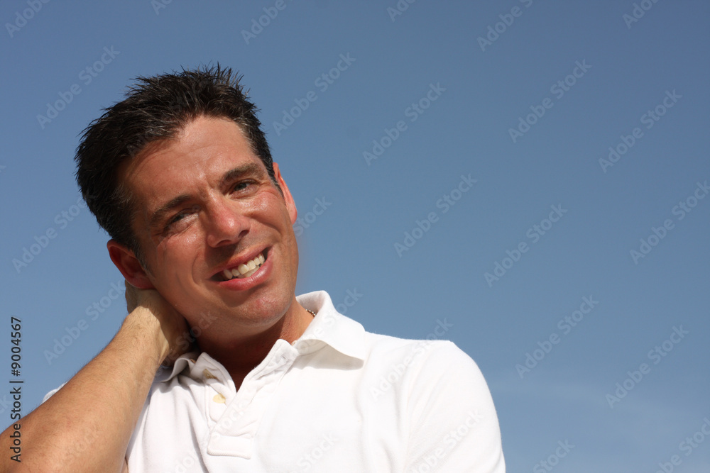 Wall Mural Middle-aged male on a blue sky
