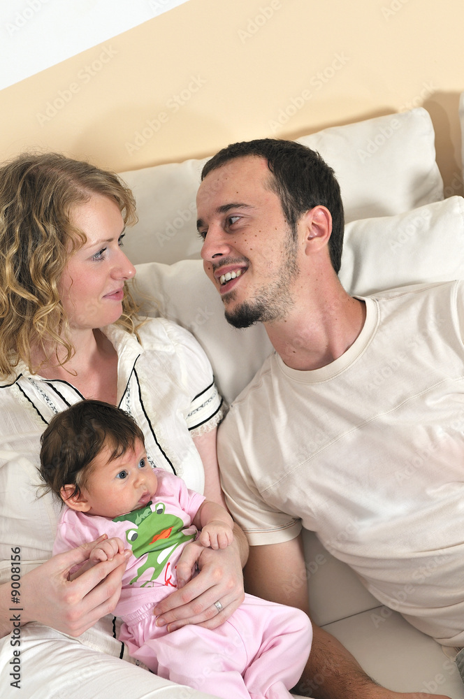 indoor portrait with happy young family and cute little babby indoor portrait with happy young family and cute little babby