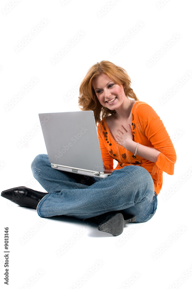 Portrait of a teenager sitting with a laptop computer
