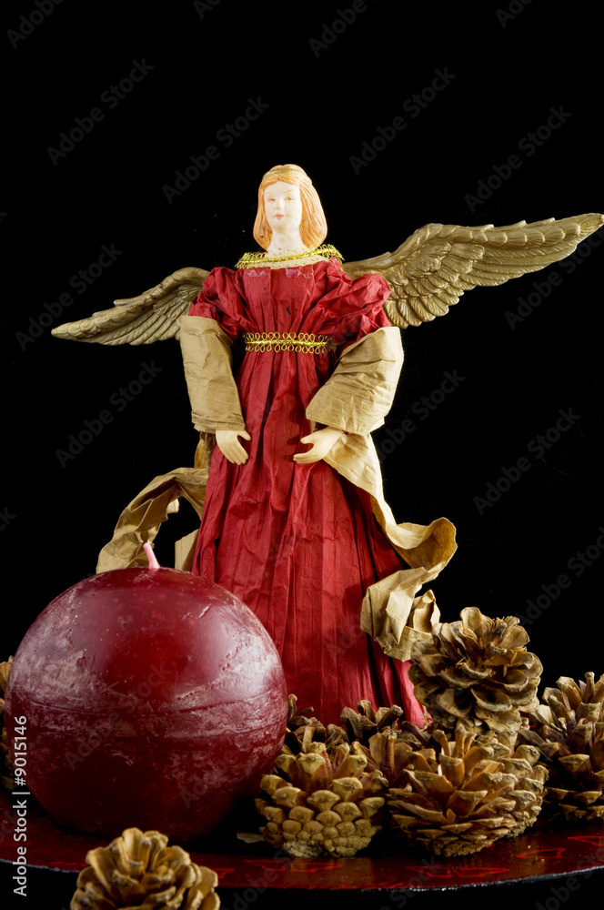 Christmas angel in red with pine cones