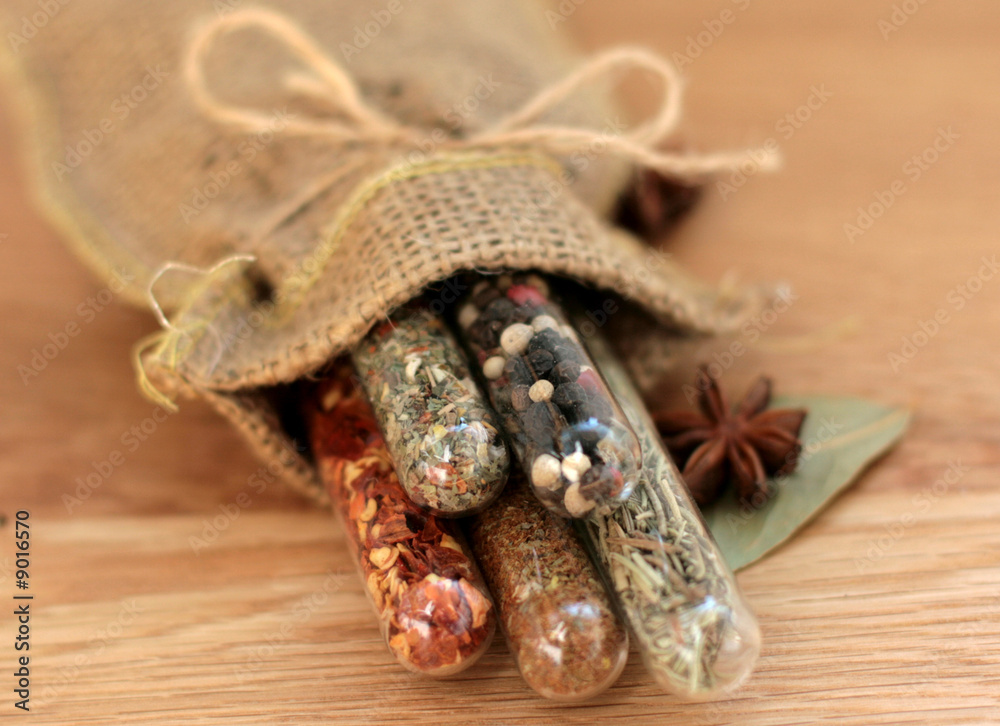Fototapeta premium spices in a glass on wood table