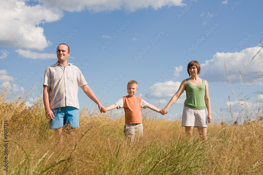 happy family walking together on a sunny day happy family walking together on a sunny day