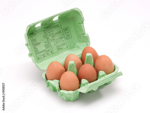 An open egg box with six eggs