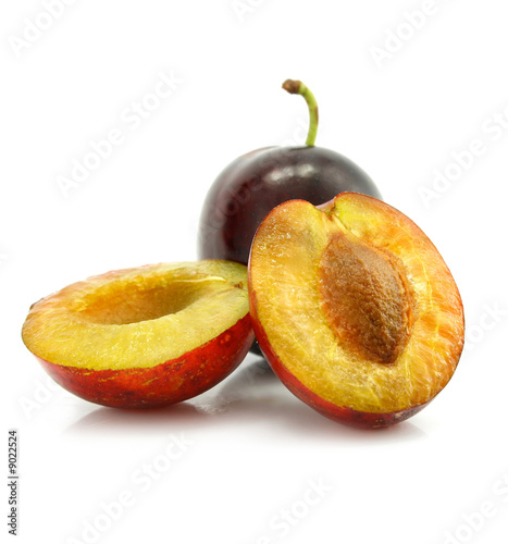 plum fruit with cut isolated on white background